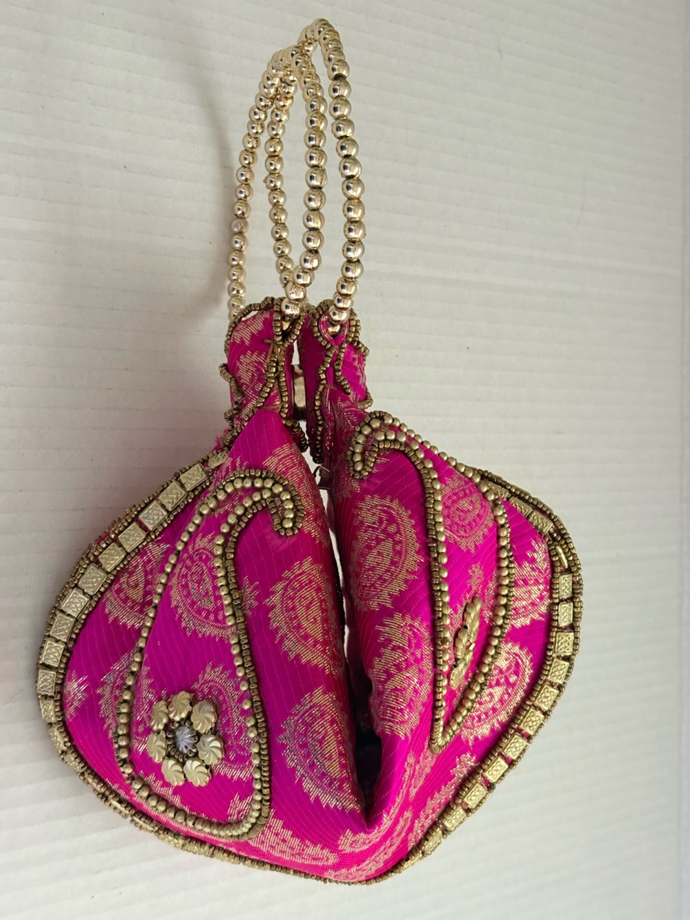 Gold-Embellished Hot Pink Evening Potli Bag with embellished beadwork